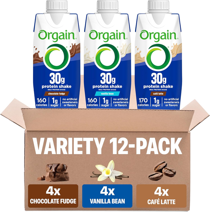 Orgain protein shake variety pack with three flavors on a cardboard box on a white background