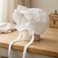 Classic White Baby Bonnet with Ruffle Trim & Tie Closure