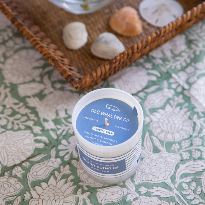 Top view of Coastal Calm Candle sitting on decorated table