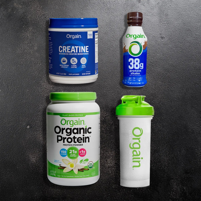 Orgain protein products including creatine, protein shake, protein powder, and shaker on a dark background