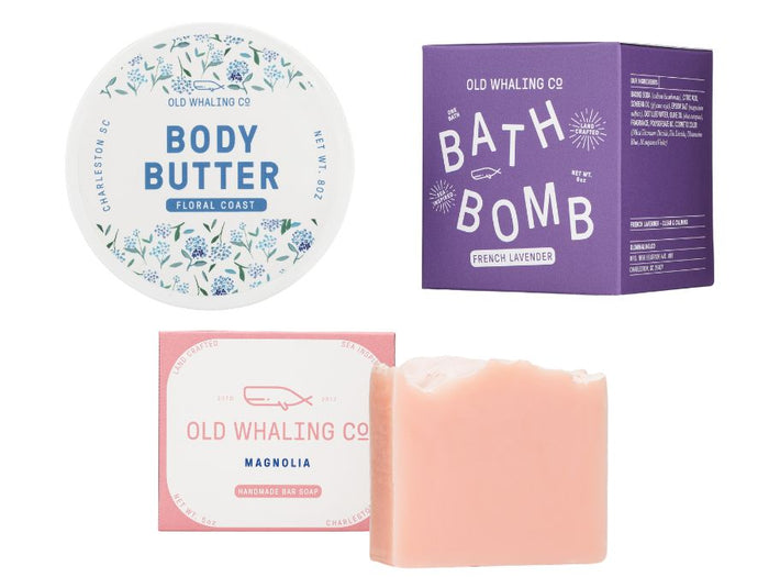 Collection of Old Whaling Co products including body butter, bath bomb, and soap on a white background