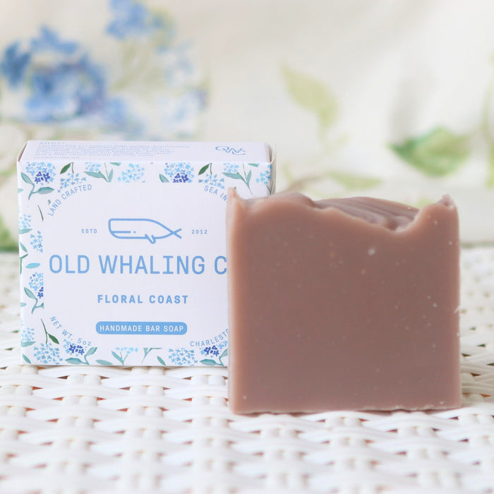 Floral Coast Soap and packaging sitting on woven mat