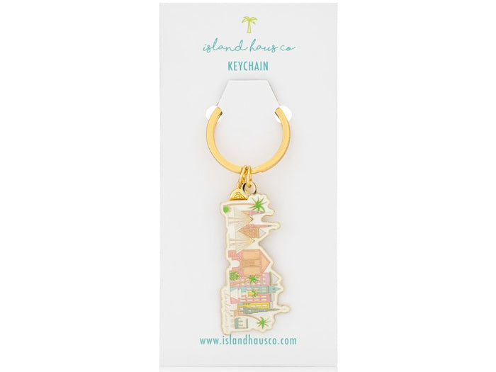 Charleston Keychain by Island Haus Co on white background, keychain has colorful houses, sailboats and palm trees design