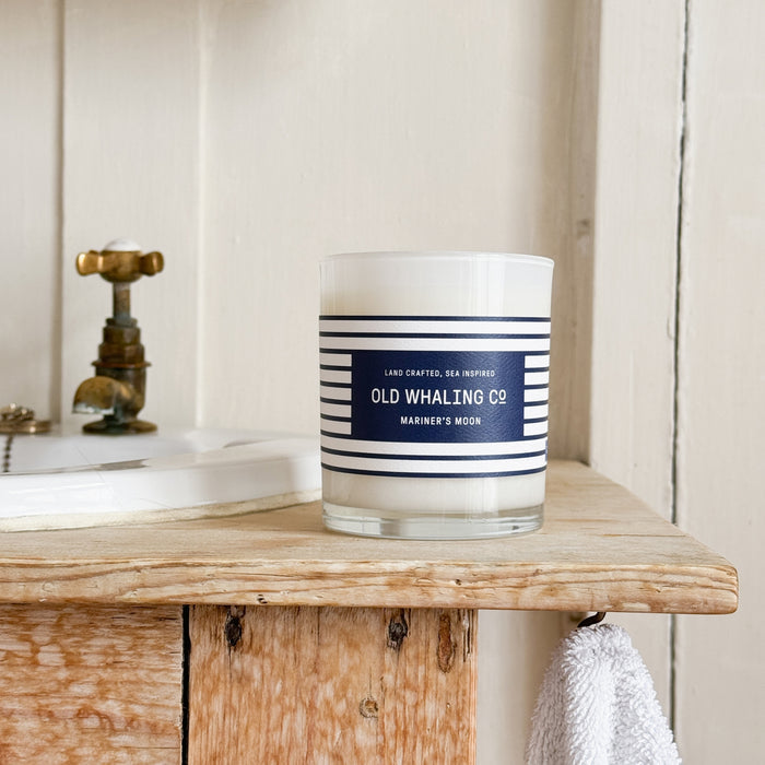 Front view of Mariner's Moon Candle on wood sink