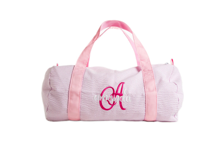 Oh Mint personalized children's duffel — shown open with contents