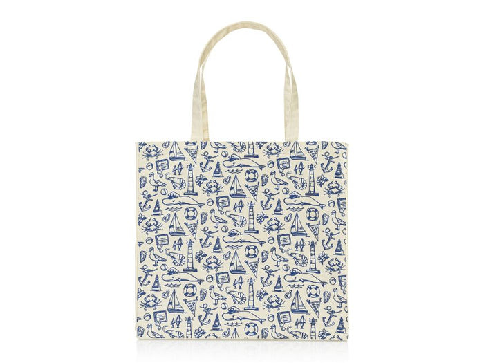 Old Whaling Company canvas tote with navy print featuring whale, sailboat, lighthouse and other nautical icons on white background