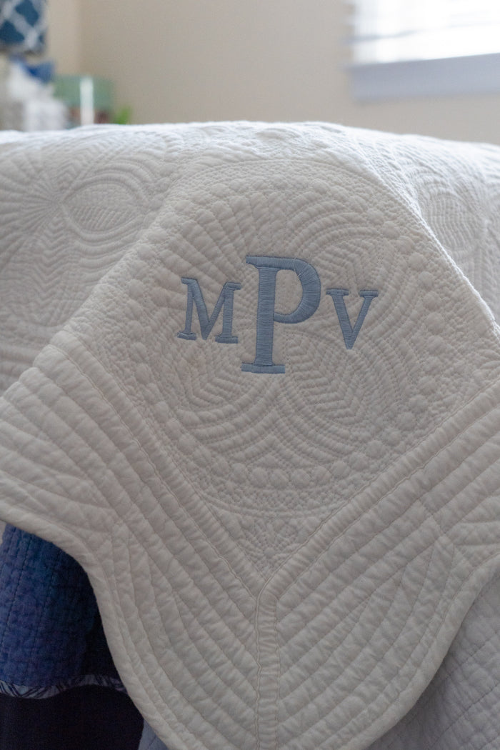 Personalized baby quilt — shown folded, ready to gift