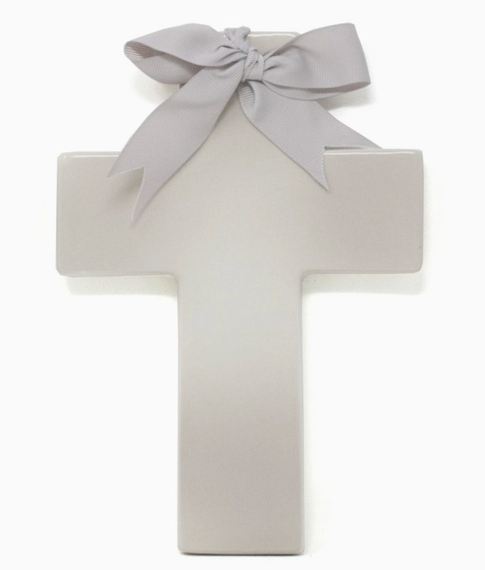 Personalized ceramic ombre cross — styled on shelf with baby items