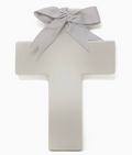 Personalized ceramic ombre cross — styled on shelf with baby items