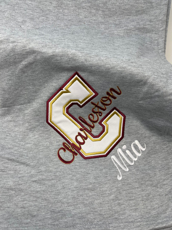 Personalized college sweatshirt blanket — shown folded, great graduation gift