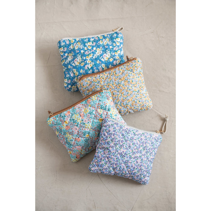 Quilted floral chintz zip pouch — shown open with contents