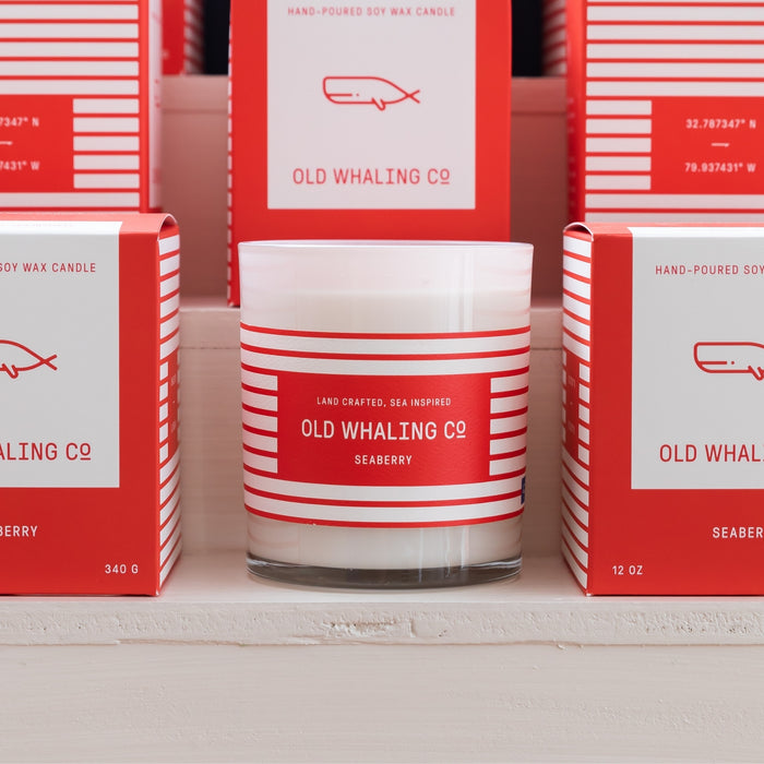 Close up front view of Seaberry Candle on tiered retail display