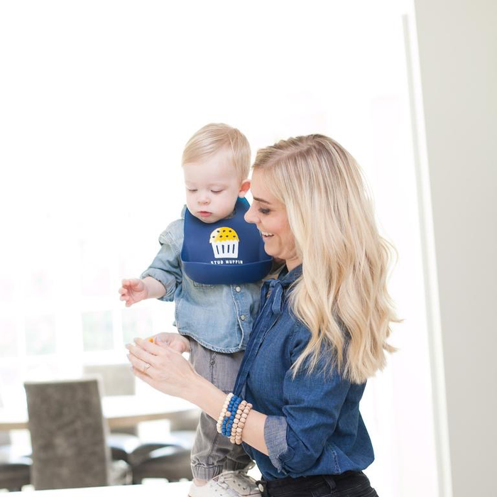 Stud Muffin Wonder Bib — shown on baby