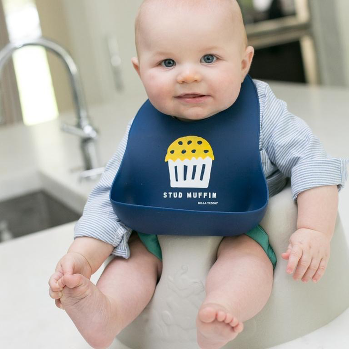 Stud Muffin Wonder Bib — flat lay showing full design