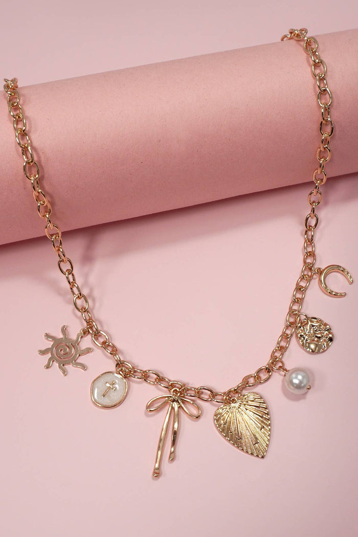 SUN BOW PEARL CROSS DISC  CHARM NECKLACE