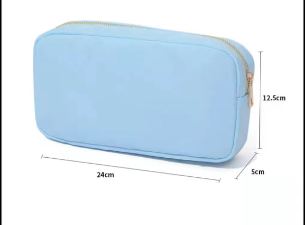 The Lindsay nylon makeup bag — shown open with compartments